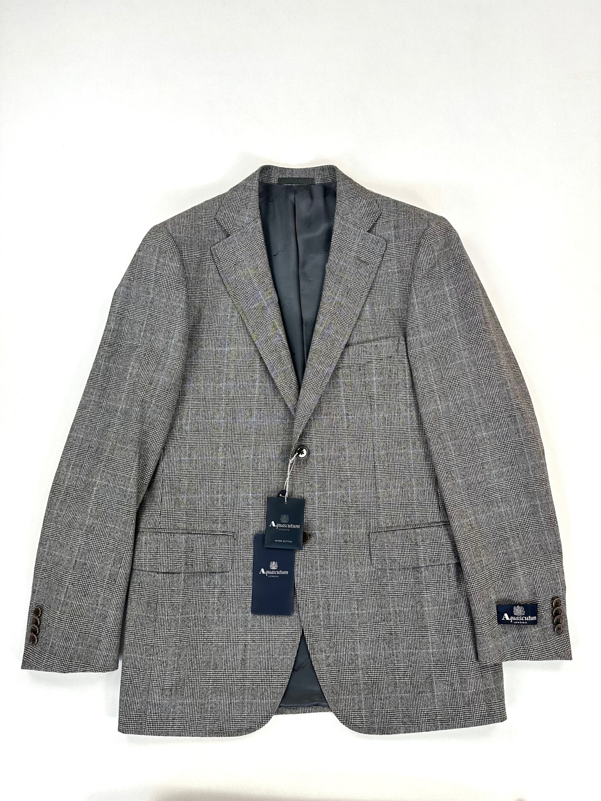 Giacca Aquascutum Principe di Galles vista di fronte, monopetto a un bottone con cartellini originali applicati