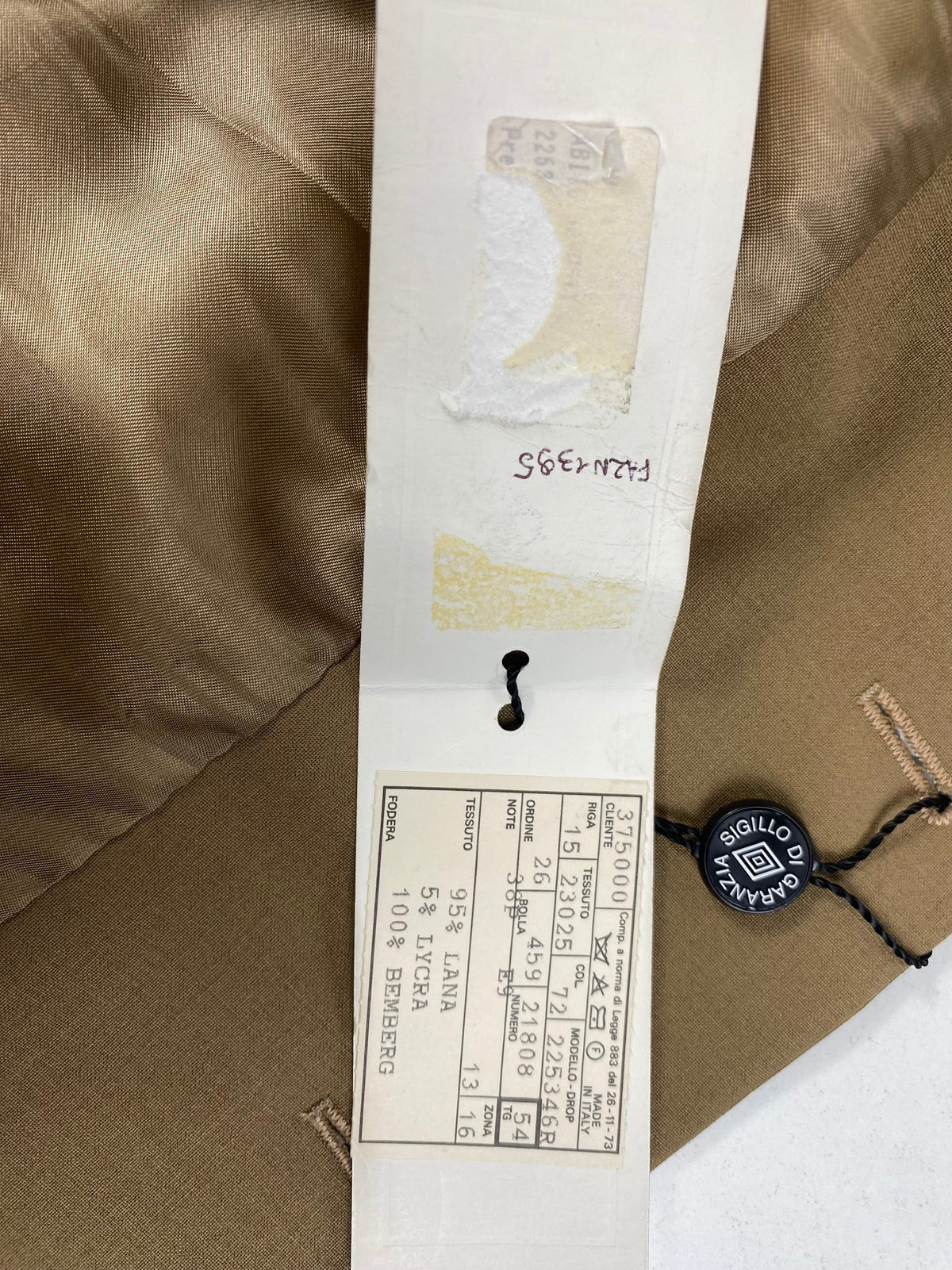 Cartellino originale Garrett's con sigillo di garanzia e scheda tessuto 95% lana 5% lycra