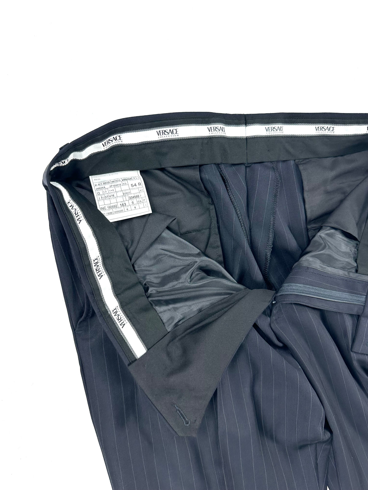 Interno vita del pantalone con nastro firmato Versace Collection