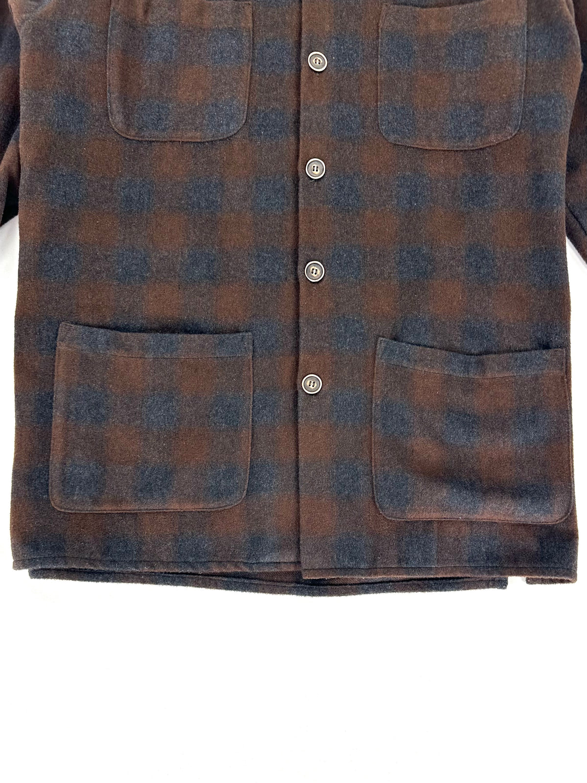 Tasche inferiori applicate e spacchetto laterale della camicia giacca Millibar