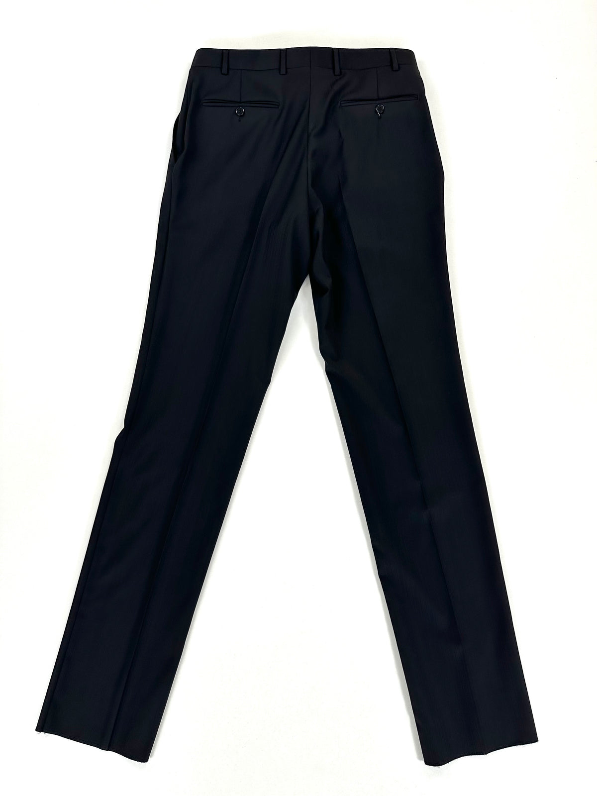 Pantalone Canali gessato scuro steso per intero, fondo grezzo ancora da orlare