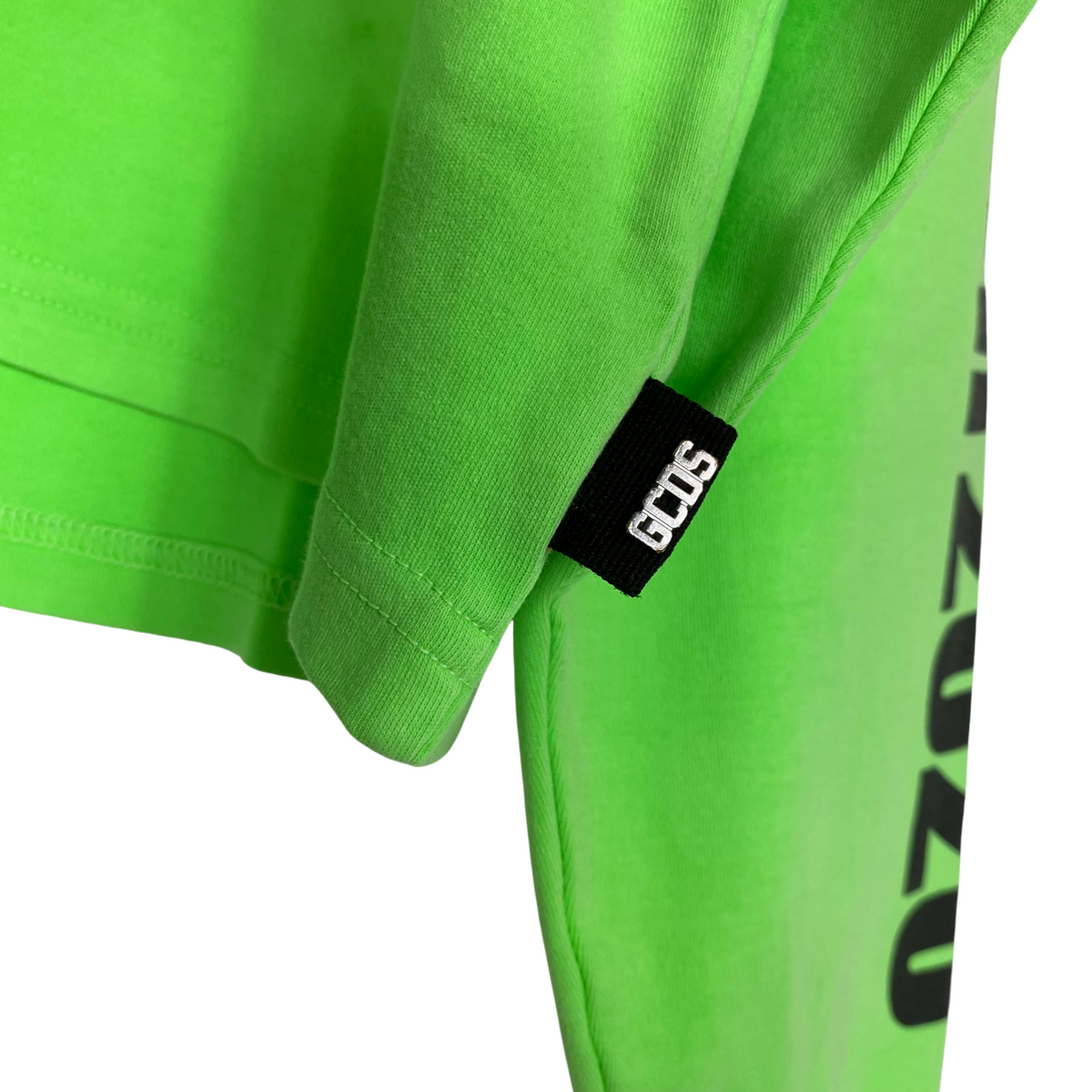 Maglione GCDS verde fluo da donna, etichetta e composizione