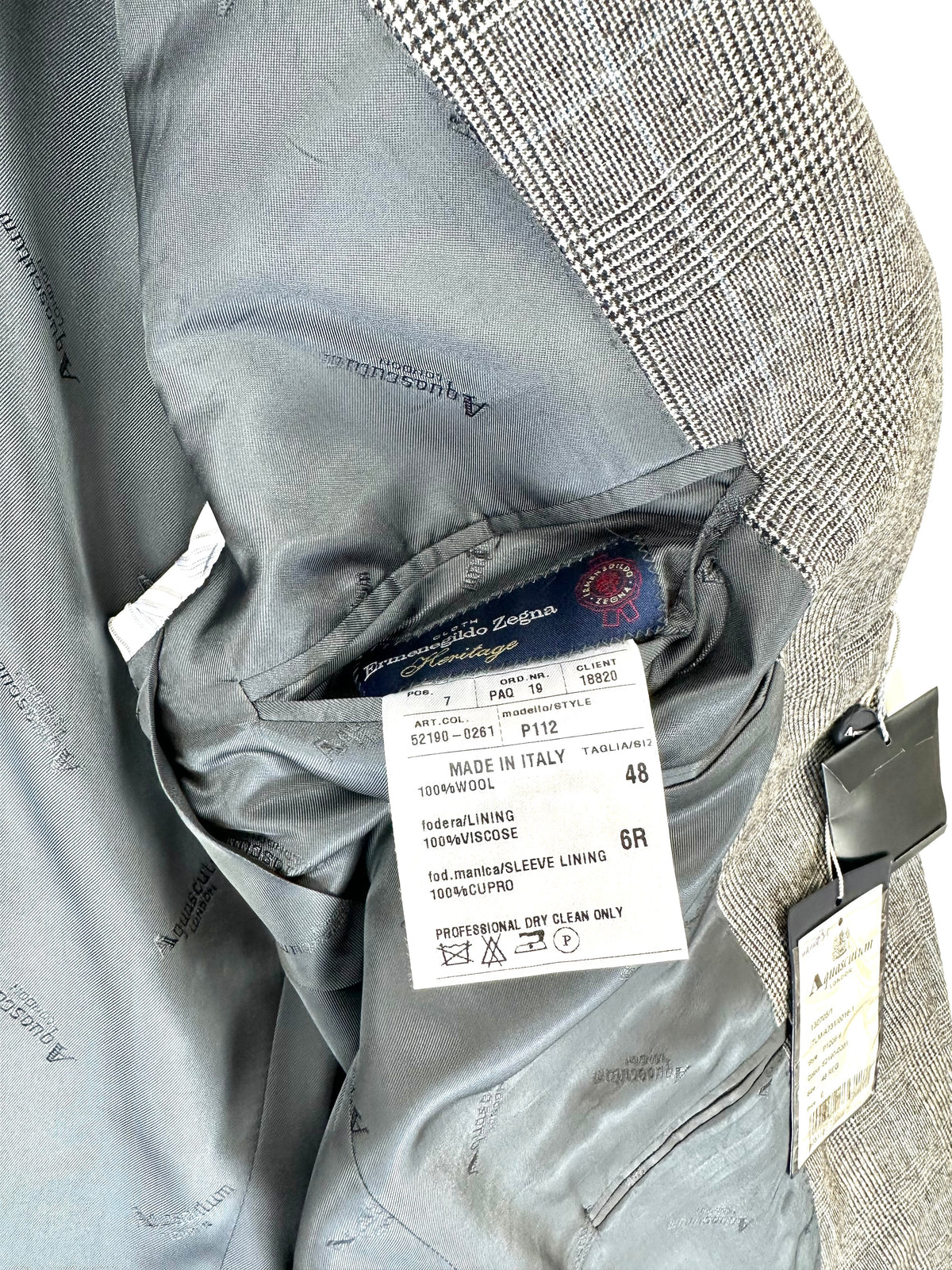 Etichetta interna del completo: Made in Italy, 100% lana, fodera viscosa e fodera manica cupro, taglia 48 drop 6