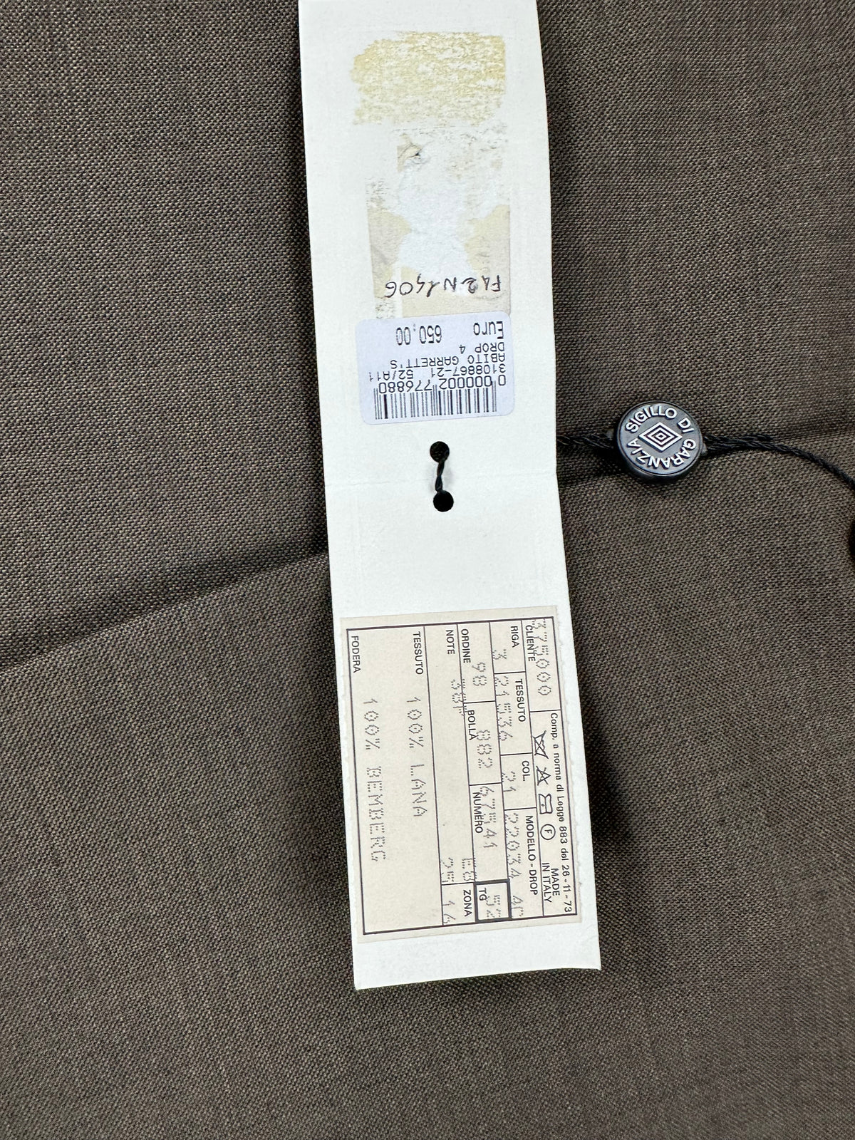 Cartellino originale Garrett's con sigillo di garanzia: abito drop 4, taglia 52, listino € 650,00