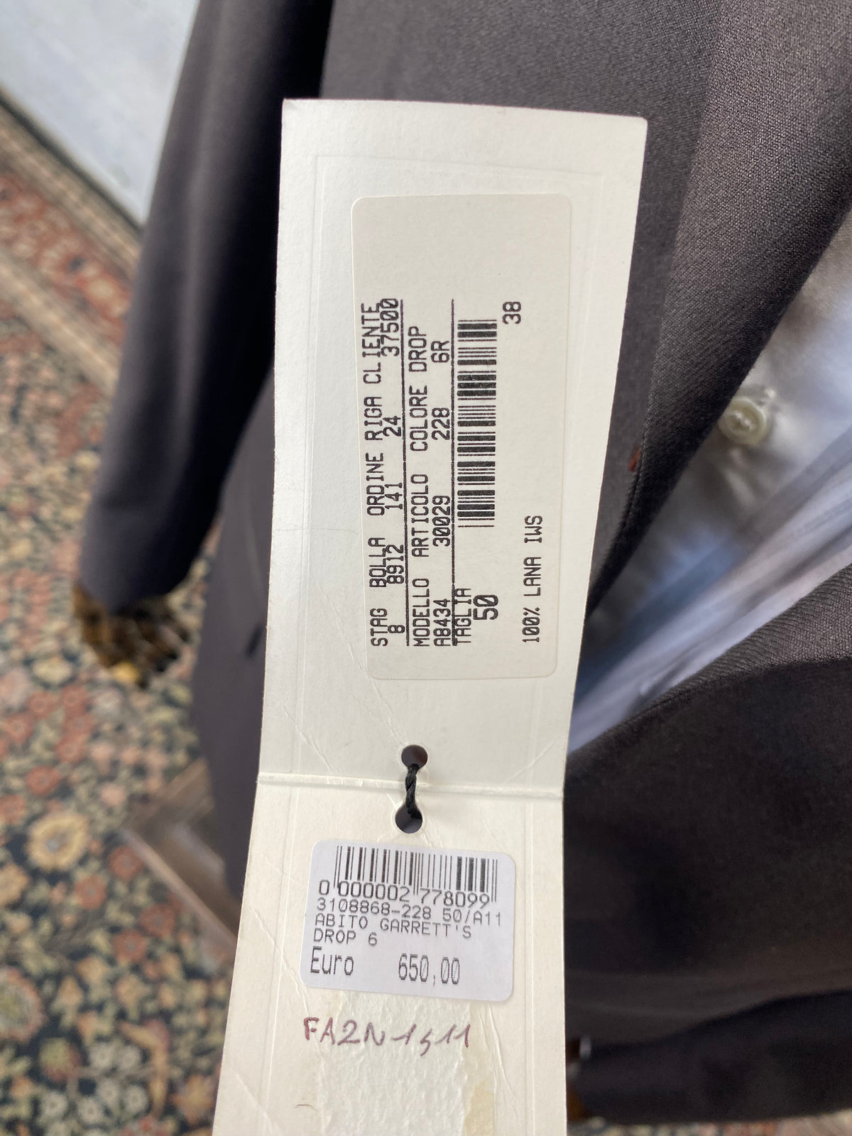 Cartellino originale Garrett's: 100% lana IWS, listino 650 euro