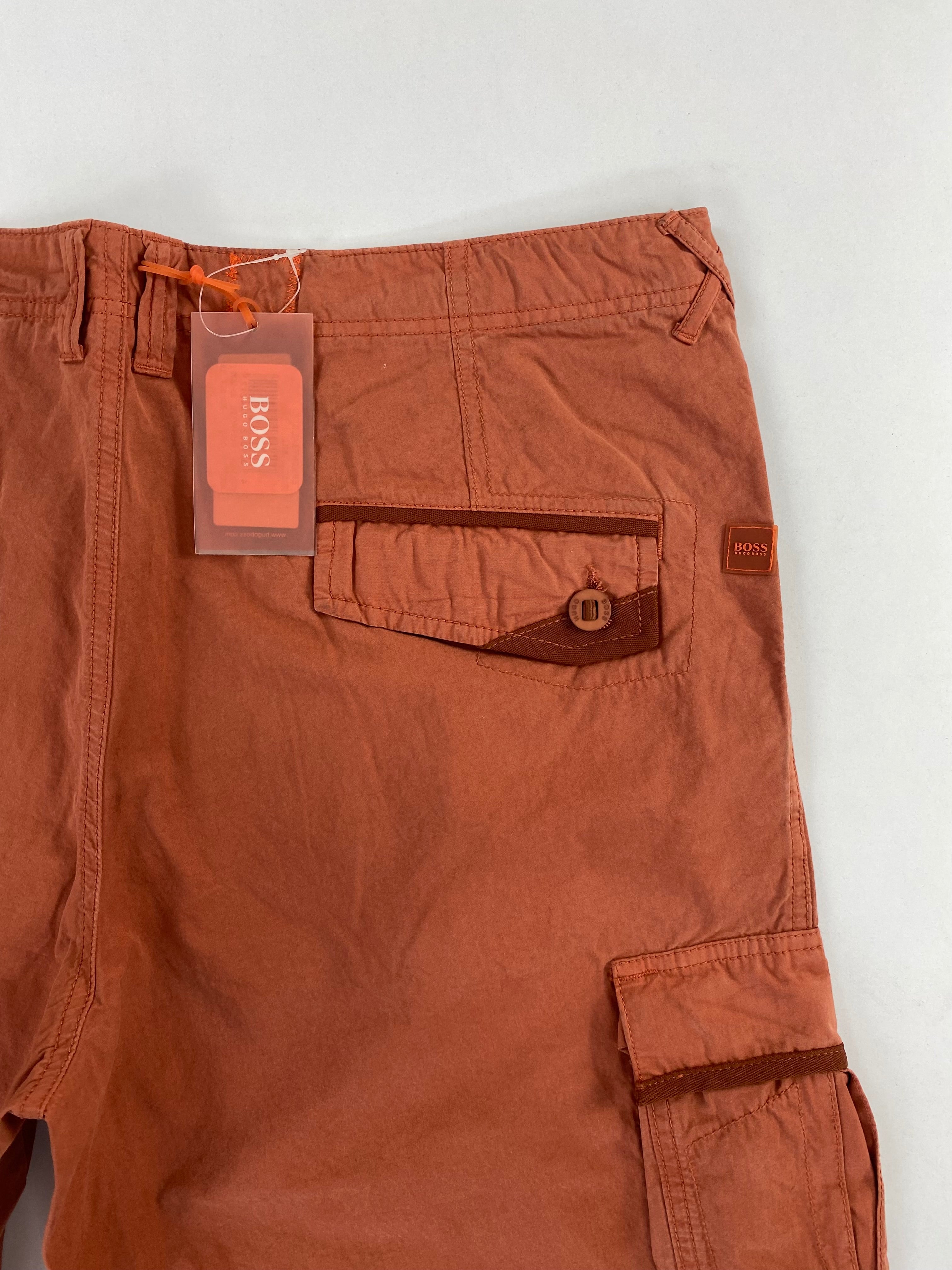 Pantalone Hugo Boss Orange Miltuss cargo arancio, dettaglio tasche anteriori oblique
